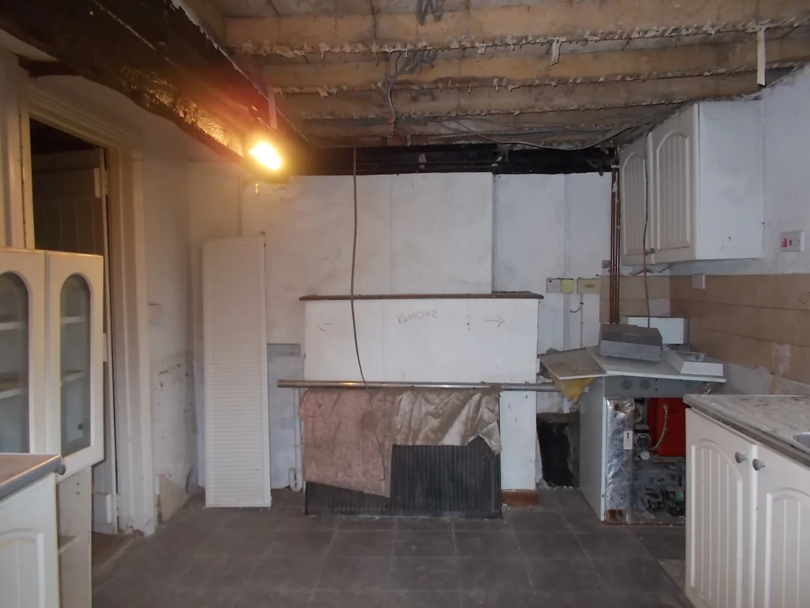 Kitchen stripped back to exposed joists during the works