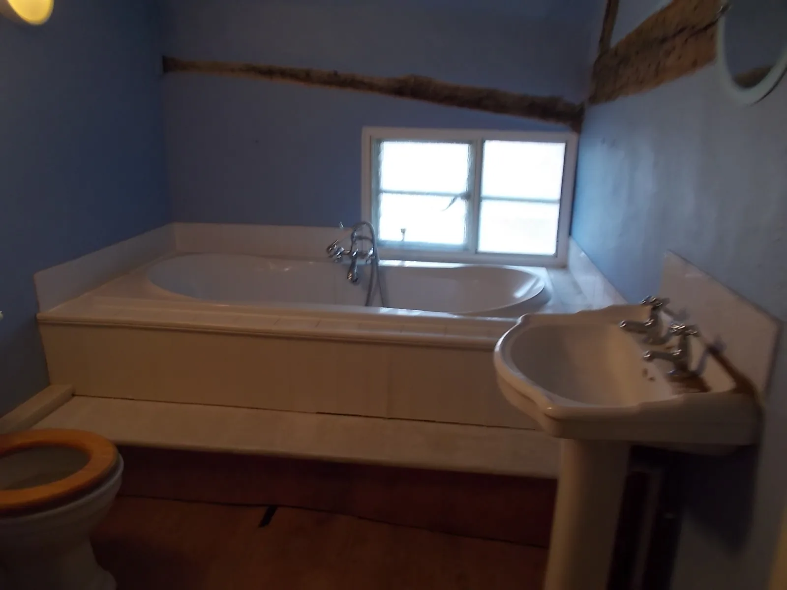 Dated blue bathroom before replacement