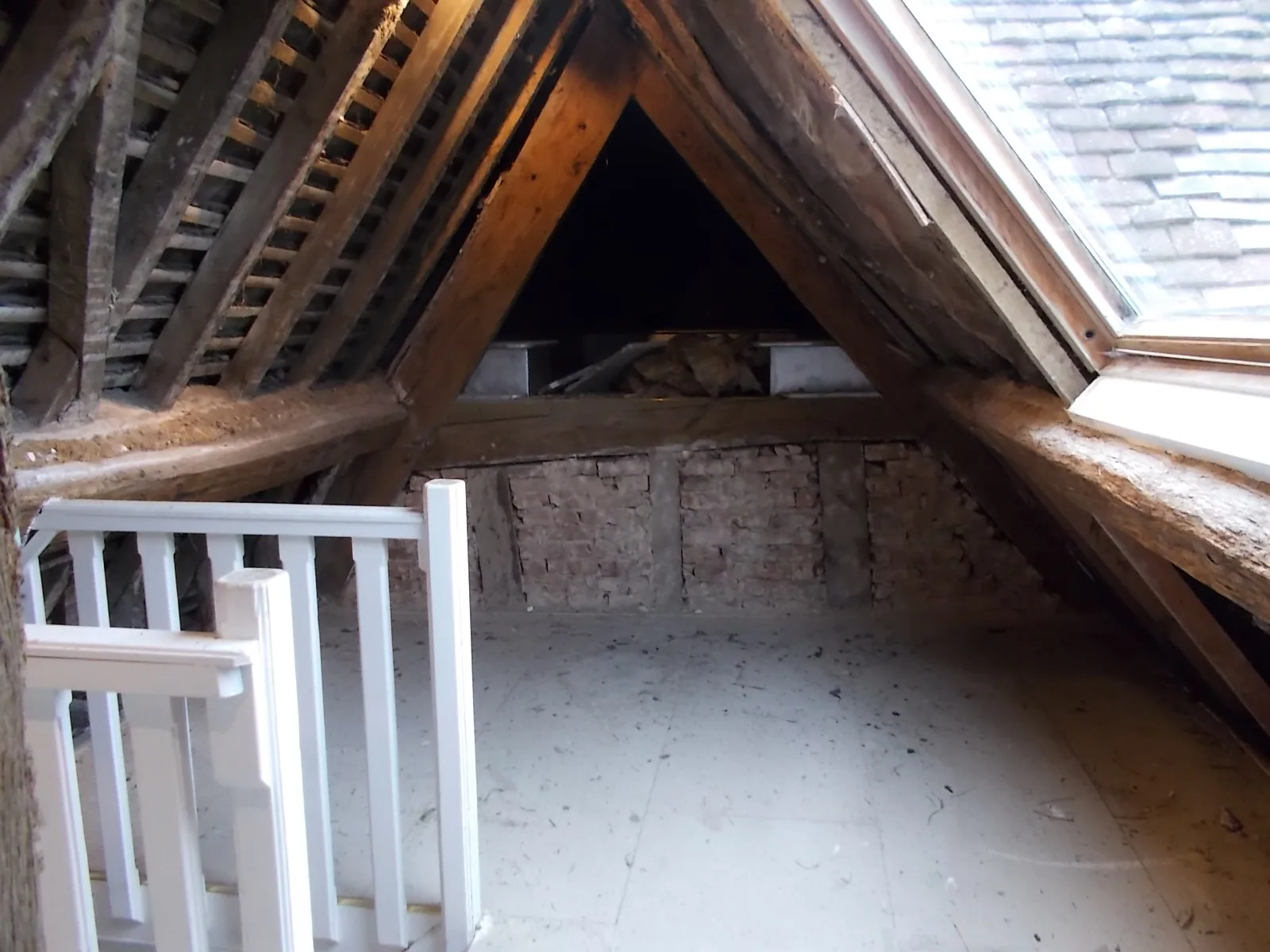 Attic with roof timbers exposed during structural works